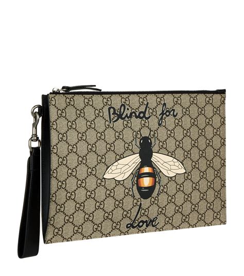 bee stripe gucci pouch|Gucci bee belt.